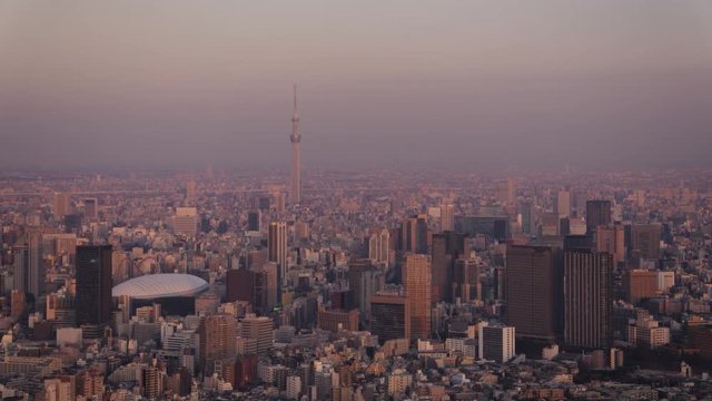 Japan Tokyo Aerial v56 Flying over Shinjuku area with cityscape views at sunset