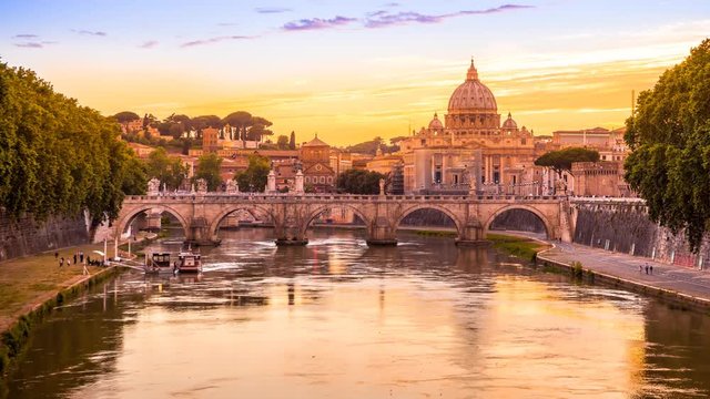 Time lapse in 4K of Cityscape of Rome at twilight to night. with San Pietro cathedral, Sant'Angelo bridge and Tiber river illuminated by city lights of Roma in Italy.