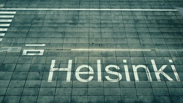 Aerial view of commercial plane landing at Helsinki airport. Travel to Finland conceptual 4K intro animation