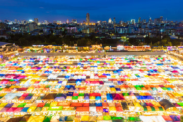 Colorful stalls at Night market with Cityscapes background in Bangkok, Thailand