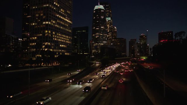 Freeway traffic in downtown Los Angeles at night. Evening Rush Hour Traffic. 4K