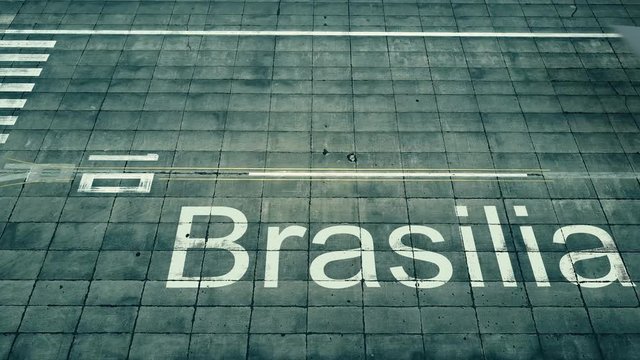 Aerial view of commercial plane landing at Brasilia airport. Travel to Brazil conceptual 4K intro animation