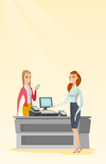 Woman paying wireless with a smartphone.