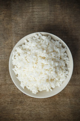 Jasmine rice isolated on wooden table