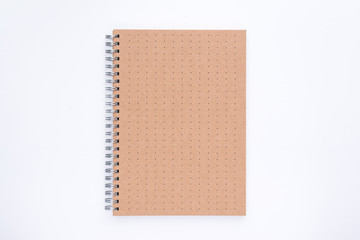 The top view of cover  brown got pattern spiral notebook on white background