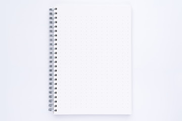 Top view of spiral notebook with dotted pattern pages
