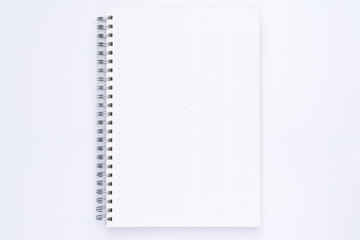 Top view of spiral notebook with dotted pattern pages