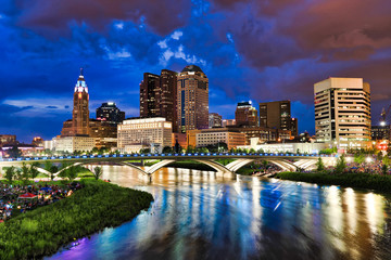 Crowds gather along the banks of the Scioto River In Columbus, Ohio in anticipation of the annual red, white and boom fireworks display