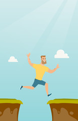 Young caucasian sportsman jumping over the cliff.