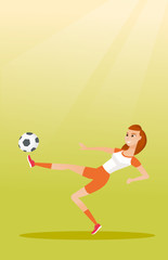 Fototapeta na wymiar Young caucasian soccer player kicking a ball.
