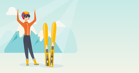 Young caucasian skier standing with raised hands.