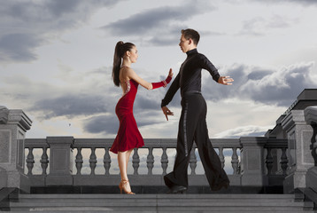 Pair of dancers dancing ballroom