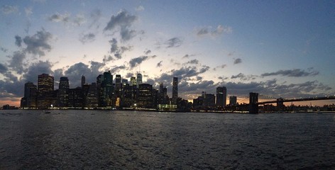 Fototapeta premium Manhattan over river before sunset in panorama