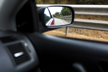 Right mirror car on the road