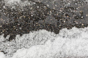 Many small ice balls after a storm on the floor