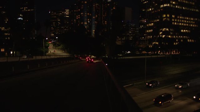 Freeway traffic in downtown Los Angeles at night. Evening Rush Hour Traffic. 4K