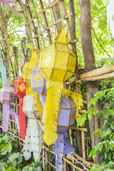 colorful paper, textiles and bamboo lamp lighting and decoration flags made with THAI traditional handmade craft style for modern usage as street decoration in LOY KRATHONG festival in THAILAND