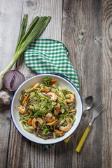 Green tagliatelle with seafood. Mussels; Prawns