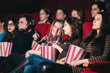 Two friends in the cinema on comedy