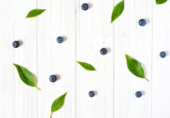 Blueberries on white wooden background