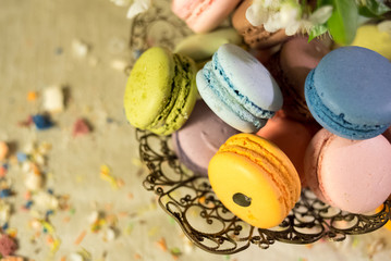 Multicolored macaroons in old eastern braided vase