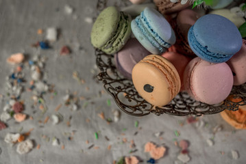 Multicolored macaroons in old eastern braided vase
