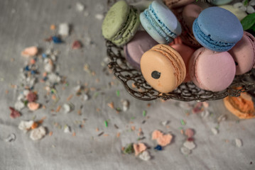 Multicolored macaroons in old eastern braided vase