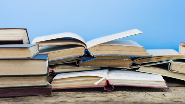 Books on an old wooden table. Beautiful background.