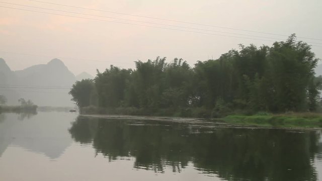 Dragon(Yulong) river Sunrise, shooting on bamboo raft. - Yangshuo Guilin, Guangxi, China.