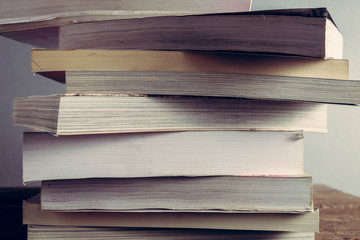 The book is on a wooden table with filter effect retro vintage style