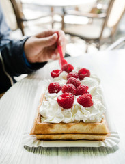 women eating belgian waffles