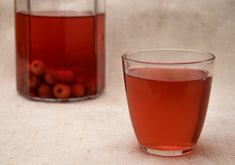 Red compote of berries in a glass.