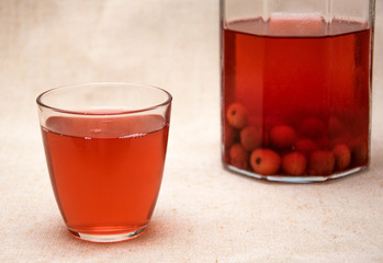 Red compote of berries in a glass.