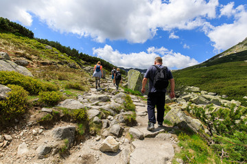 Fototapeta na wymiar People with backpacks hiking in Tatra Mountains, Poland