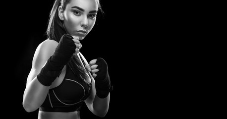 Female boxer. Isolated on black background. Copy Space. Sport concept.