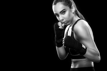 Sportsman muay thai boxer fighting. Isolated on black background. Copy Space. Sport concept.