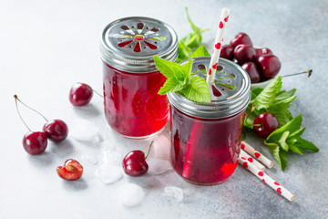 Refreshing summer drink with cherry and mint. The concept of healthy and dietary nutrition.