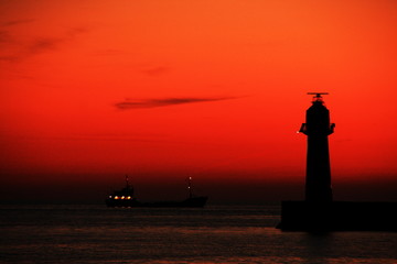 Fototapeta premium The lighthouse in a sunset