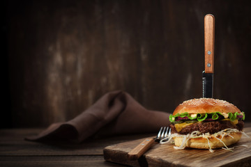 Burger with chop and onion - obrazy, fototapety, plakaty