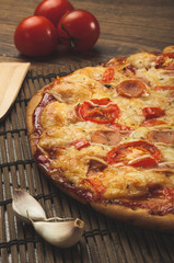 Delicious fresh pizza served on wooden table