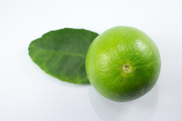  lemon and green leaf isolated on white background