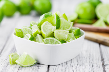 Wooden table with Lime Slices (selective focus)