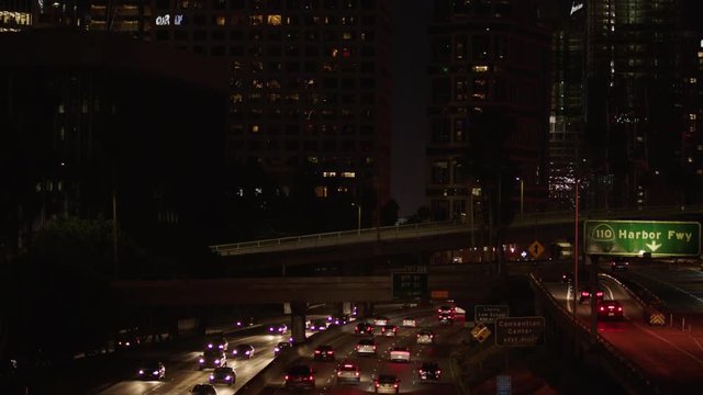 Freeway traffic in downtown Los Angeles at night. Evening Rush Hour Traffic. 4K