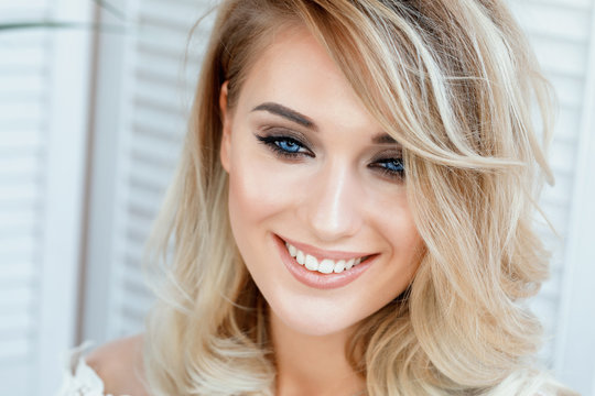 Portrait of a beautiful young blonde girl close-up