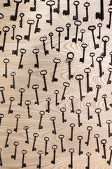 top of view of old keys, the background is made of wood