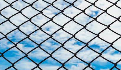 Fototapeta premium Siluate Cage With Blur Blue Sky and Clouds Background