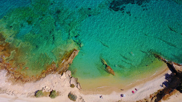 Aerial drone photo of Koufonisi island with clear turquoise waters, Cyclades, Greece