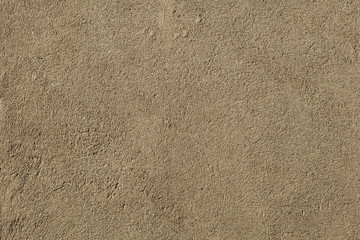 Brown painted stucco wall.