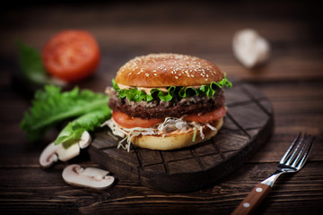 Burger with chop and mushrooms
