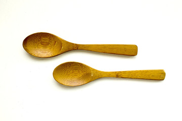 Wood spoons on white background on top view. for food concept.